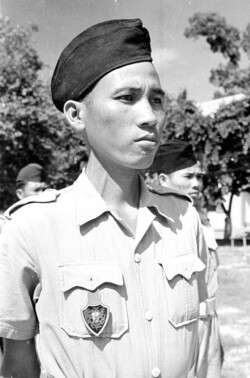 1950 portrait of a Cao Đài Militia soldier wearing the distinctive pocket crest badge. This is the locally made variation. Photo: Harrison Forman LIFE Magazine 1950. 1950 portrait of a Cao Đài soldier wearing the distinctive pocket crest badge. This is the locally made variation. Photo: Harrison Forman LIFE Magazine 1950.