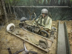British paratrooper removing his Welbike motorcycle from it's drop container in the Market Garden display at the Arnhem Oorlogsmuseum 40-45. Photo: Julian Tennant.