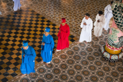 Tay Ninh, 96km northwest of Ho Chi Minh City is home to the “Holy See” of the once powerful Cao Dai religious sect. Founded in 1926 and based on messages revealed in séances to it’s founder, Ngo Minh Chieu, Cao Dai incorporates elements of Buddhism, Hinduism, Taoism, Confucianism and Spiritualism. It’s pantheon of deities includes Buddha, Confucius, Jesus Christ, Mohammed, Joan of Arc, Sun Yat Sen and Victor Hugo amongst others. The clergy is based on the Roman Catholic hierarchy and headed by a ‘pope’.
In the 1930’s the sect became increasingly nationalistic and organised it’s own militias, running Tay Ninh province as an almost independent feudal state. They were involved in revolts against the French before and during WW2, co-operating with the Japanese and then allying themselves to the Viet Minh in the early years of the post war struggle against the French administration. A pragmatic group they switched sides, giving nominal allegiance to the Emperor Bao Dai and the French, whilst still retaining anti-French sentiment. The Cao Daists provided the basis for the ‘Third Force’ in Graham Greene’s classic novel, “The Quiet American” and by 1956 boasted an army of about 20 000 troops.
During the second Indochina war (known to the Vietnamese as the ‘American war’) they were allied to the South Vietnamese government and refused to aid the Viet Cong, a point not lost to the Communists who redistributed their lands and executed a four of their leaders after taking power. It wasn’t until 1985 and the Cao Dai had been thoroughly pacified were they allowed to once again take control of their ‘Holy See’ and some 400 temples across Vietnam. Today it is estimated that there are some 2 – 3 million followers world wide.
All Cao Dai temples hold religious ceremonies every six hours starting at midnight during which the clergy and lay people perform an elaborate, regimented ritual which includes offerings of incense, tea, alcohol, frui