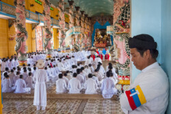Midday prayer service at the Cao Đài Holy See in Tây Ninh. Photo: Julian Tennant