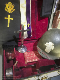 Display featuring objects belonging to Francis L. Sampson, the 501st PIR's "Parachuting Padre". Photo: Julian Tennant US Paratrooper's D-Day Experience Museum. Saint-Côme-du-Mont, Normandy