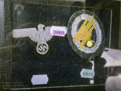 German insignia for sale in the 'Paratrooper' shop at the Dead Man's Corner Museum. Photo: Julian Tennant 'Dead Man’s Corner' - German Paratrooper Museum – Saint-Côme-du-Mont, Normandy