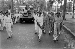 Soldiers of the Vietnamese National Army accompany the casket of General Trình Minh Thế during his funeral procession in Saigon in May 1955.  Photo: Harrison Forman LIFE Magazine.