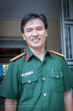 Officer of the Vietnam People's Ground Forces (Lục quân Nhân dân Việt Nam) on duty at the museum. His insignia identifies him as a Senior Lieutenant (Đại úy) from the Corps of Engineers. Photo: Julian Tennant