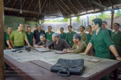 Communist commanders listening to the surrender of President Minh on the radio in their headquarters. Photo: Julian Tennant