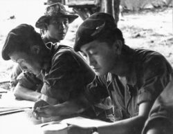 Thai PARU instructors going over the morning's training programme for their Lao recruits at Hua Hin. Photo: J. Vinton "Vint" Lawrence