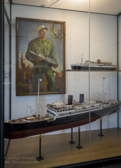 Painting - "The Legionnaire and Sidi Bel Abbès 1949" and two models of the ocean liner Sidi Bel Abbès, which was requisitioned during WW2 as a troop transport. It was torpedoed by the Germans on 20 April 1943, resulting in the deaths of 834 passengers and crew. The smaller model is the second ship, of the same name, which was launched in 1948. It brought the last remnants of the 1st REI from Oran to Marseille in 1962. French Foreign Legion Museum Aubagne Musée de la Légion Etrangère