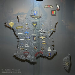 Map of France featuring the insignia of the various French airborne and special forces units of WWII.