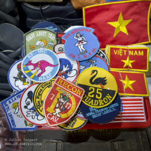 Dan Sinh War Surplus Market. March 2026. FAKE patches, including Australian units that never deployed to Vietnam. Photo: Julian Tennant Dan Sinh War Surplus Market