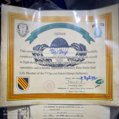 Dan Sinh War Surplus Market. March 2026. FAKE US Special Forces certificate. Apart from the signature and date, the print quality and detail is noticeably different from the original certificates of the period. Photo: Julian Tennant Dan Sinh War Surplus Market